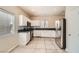 Clean kitchen featuring stainless steel appliances, white cabinets, and granite countertops at 5921 Royal Castle Ln, Las Vegas, NV 89130