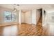 Spacious living room with hardwood floors and staircase in a well-lit home at 5921 Royal Castle Ln, Las Vegas, NV 89130