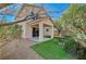 A lush backyard with artificial grass and a covered patio extends the living space at 6424 Bombax Ct, Las Vegas, NV 89141