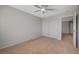 Bright bedroom features neutral walls, carpet flooring, and a ceiling fan at 6424 Bombax Ct, Las Vegas, NV 89141