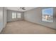 Spacious bedroom with carpet, large windows and shutters allowing ample natural light at 6424 Bombax Ct, Las Vegas, NV 89141