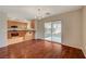 The dining area features hardwood floors, access to the back patio, and an adjacent kitchen at 6424 Bombax Ct, Las Vegas, NV 89141