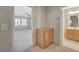 Hallway view of a bedroom with fan and a bathroom with wood vanity at 6424 Bombax Ct, Las Vegas, NV 89141
