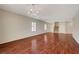 Spacious living room with hardwood flooring and natural light at 6424 Bombax Ct, Las Vegas, NV 89141