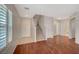 Inviting living room featuring hardwood floors, neutral paint, and staircase at 6424 Bombax Ct, Las Vegas, NV 89141