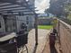 Charming backyard patio with dining area, lush lawn, mountain views, and a trellis at 7136 Overhill, Las Vegas, NV 89129