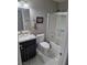 Bathroom showcasing a modern vanity, granite counters, updated fixtures, and tiled shower with tub at 7136 Overhill, Las Vegas, NV 89129