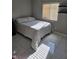 Bedroom with neutral colors, tile floors, bright natural light, and ample closet space at 7136 Overhill, Las Vegas, NV 89129