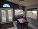Dining area with chandelier and French doors leading to the backyard patio at 7136 Overhill, Las Vegas, NV 89129
