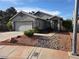 Charming single-story home with a well-maintained front yard and two car garage at 7136 Overhill, Las Vegas, NV 89129
