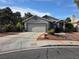 Attractive single-story home featuring a two-car garage and low maintenance desert landscaping at 7136 Overhill, Las Vegas, NV 89129