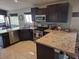 Kitchen featuring granite countertops, dark cabinetry, stainless appliances and recessed lighting at 7136 Overhill, Las Vegas, NV 89129