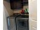 Convenient laundry room with stainless steel washer and dryer and overhead cabinet storage space at 7136 Overhill, Las Vegas, NV 89129
