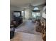 Comfortable living room with tile flooring and a large window providing natural light at 7136 Overhill, Las Vegas, NV 89129