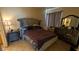 Comfortable bedroom with a large window for natural light, neutral colors, and carpeted floors at 7155 S Durango Dr # 205, Las Vegas, NV 89113