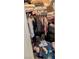 Ample storage is the hallmark of this walk-in closet, making organization a breeze at 7155 S Durango Dr # 205, Las Vegas, NV 89113
