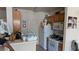 Cozy kitchen features matching appliances and a view to the living area, with ample lighting throughout at 7155 S Durango Dr # 205, Las Vegas, NV 89113