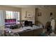 Comfortable living room with a fireplace, large windows, and tile floors at 7155 S Durango Dr # 205, Las Vegas, NV 89113