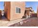 View of backyard featuring low maintenance desert landscaping, patio cover, and space for relaxing at 7237 Puddle Duck St, Las Vegas, NV 89166