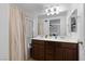 Bathroom featuring double sinks, updated fixtures, and a shower and tub combination at 7237 Puddle Duck St, Las Vegas, NV 89166