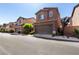 View of two-story home with a two car garage and desert landscaping at 7237 Puddle Duck St, Las Vegas, NV 89166