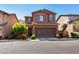 Charming two-story home with a well-maintained front yard, two-car garage, and inviting curb appeal at 7237 Puddle Duck St, Las Vegas, NV 89166
