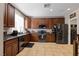 This updated kitchen features stainless steel appliances, tile floors, and plenty of counter space at 7237 Puddle Duck St, Las Vegas, NV 89166