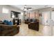 Comfortable living room with tile floors, ceiling fan, plush couches and a bright, inviting atmosphere at 7237 Puddle Duck St, Las Vegas, NV 89166