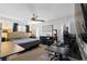 Spacious bedroom with neutral carpet, ceiling fan, walk-in closet and attached bathroom at 7237 Puddle Duck St, Las Vegas, NV 89166