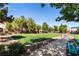 Community park with lush green grass, trees, walkway and bench at 7237 Puddle Duck St, Las Vegas, NV 89166