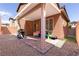 This covered patio features pavers, a grill, outdoor furniture, and a small grassy area at 7237 Puddle Duck St, Las Vegas, NV 89166