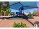 Neighborhood playground with slides and climbing features, covered to provide shade at 7237 Puddle Duck St, Las Vegas, NV 89166