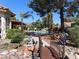 A beautifully landscaped backyard with pool and bridge feature at 7660 Descanso Ln, Las Vegas, NV 89123