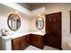 Bathroom features dual sinks, granite countertops, and wood cabinets at 7660 Descanso Ln, Las Vegas, NV 89123