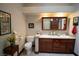Bathroom featuring double sinks, granite countertops, and stylish fixtures at 7660 Descanso Ln, Las Vegas, NV 89123