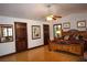 Comfortable bedroom with wood floors, ceiling fan, and closet at 7660 Descanso Ln, Las Vegas, NV 89123