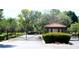 A gated entrance to a lush community at 7660 Descanso Ln, Las Vegas, NV 89123