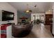 Open floorplan with living room, kitchen, and dining room at 7660 Descanso Ln, Las Vegas, NV 89123