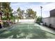 A private backyard tennis court for recreational enjoyment at 7660 Descanso Ln, Las Vegas, NV 89123