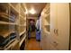 Walk-in closet with custom storage, shelving and clothing racks at 7660 Descanso Ln, Las Vegas, NV 89123