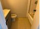 Bathroom featuring a vanity with sink, toilet, and a tiled shower and tub at 805 Slayton Dr, Las Vegas, NV 89107