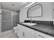 Bathroom with granite countertops, modern sink, framed mirror, and glass-enclosed shower at 8127 Chambersberg St, Las Vegas, NV 89147