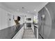 Modern kitchen with stainless steel appliances, a large island, and sleek countertops at 8127 Chambersberg St, Las Vegas, NV 89147