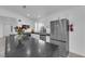 Bright kitchen features stainless steel appliances, a modern design, and an island with barstool seating at 8127 Chambersberg St, Las Vegas, NV 89147