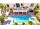 Aerial view of backyard featuring pool, jacuzzi, covered patio, upper deck, and outdoor kitchen at 884 Loma Bonita Pl, Las Vegas, NV 89138