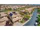Stunning aerial view of a home featuring solar panels and tile roof in a well-manicured neighborhood at 884 Loma Bonita Pl, Las Vegas, NV 89138