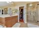 This primary bathroom features a glass enclosed shower, toilet, and a vanity with drawers and cabinets at 884 Loma Bonita Pl, Las Vegas, NV 89138