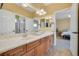 This primary bathroom features dual sinks, cabinets and drawers and is attached to the primary bedroom at 884 Loma Bonita Pl, Las Vegas, NV 89138