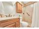 Bathroom with a single sink vanity and a shower with a curtain and tile walls at 884 Loma Bonita Pl, Las Vegas, NV 89138