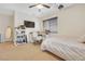 This bedroom has a ceiling fan, a flat screen TV and a cozy desk with an office chair at 884 Loma Bonita Pl, Las Vegas, NV 89138